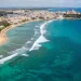 Aerial view of Puerto Rico coastline with turquoise water, Old San Juan colorful buildings.