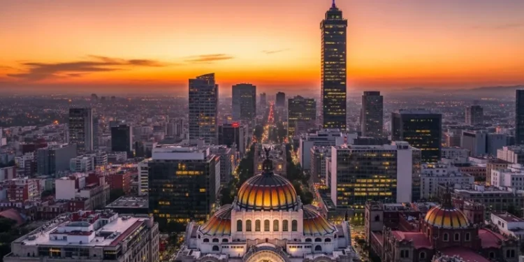 Aerial view of Mexico City skyline with Palacio de Bellas Artes and Torre Latinoamericana at sunset, vibrant city lights